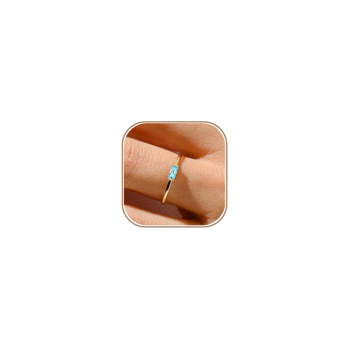 Gold birthstone ring in a layered jewelry look